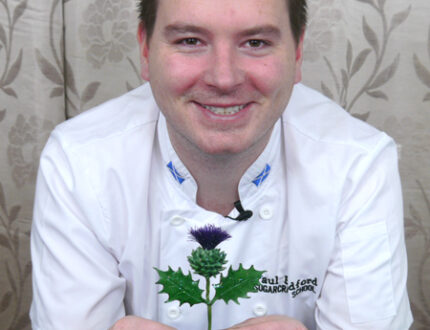 Paul holding sugar Scottish thistle