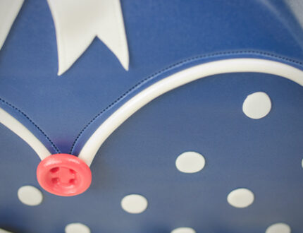 Close up of polka dots on polka dot handbag cake