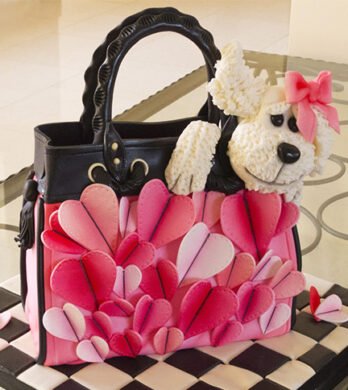 handbag cake with a we dog