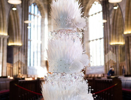 Beautiful white wedding cake with lots of bling