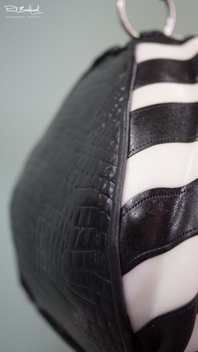 Close up of side of handbag cake