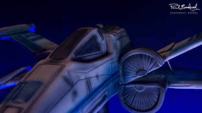 Close up of space jet fighter cake