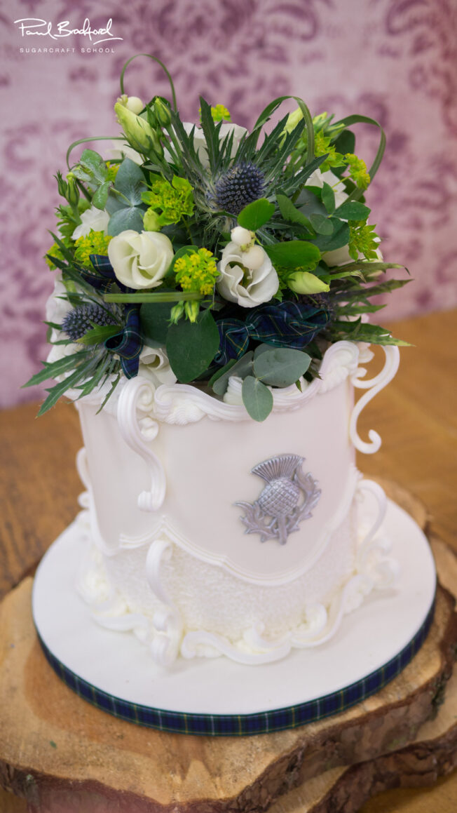 Close up of alternative flower arrangement on top of cake