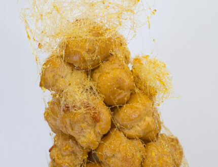 Close up of spun sugar on profiteroles