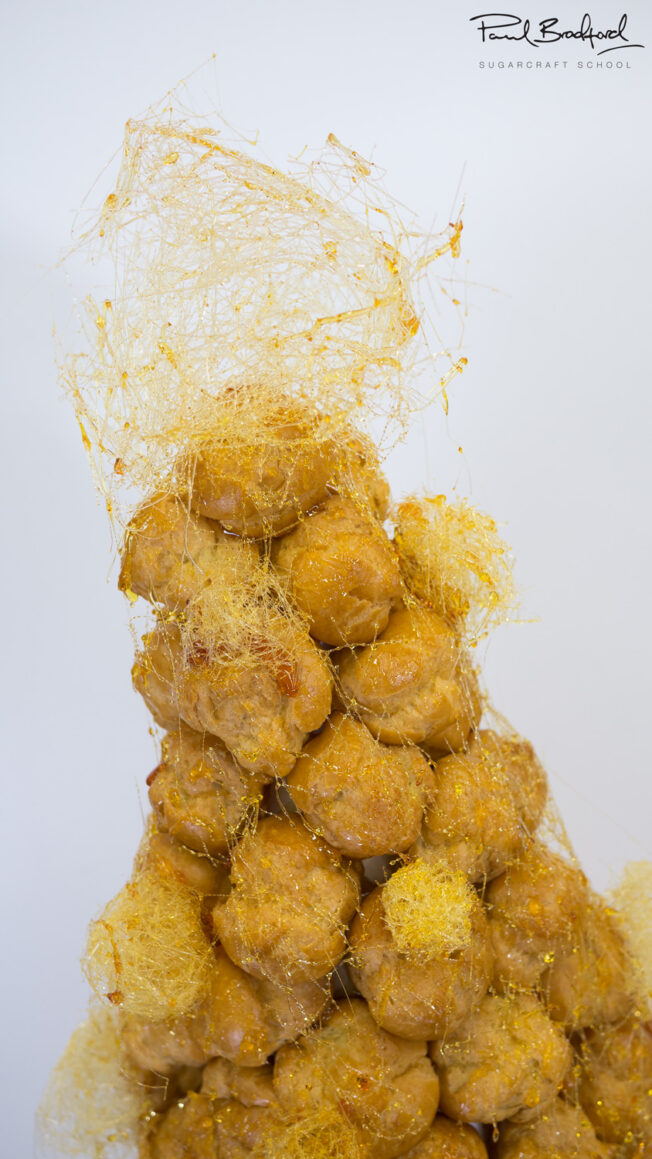 Close up of spun sugar on profiteroles
