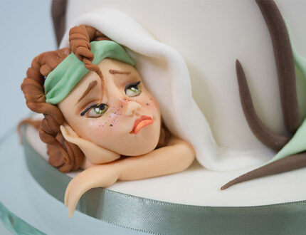 Picture of younger fairy at bottom of cake