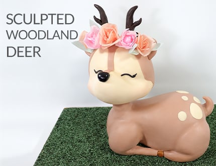 sculpted woodland deer