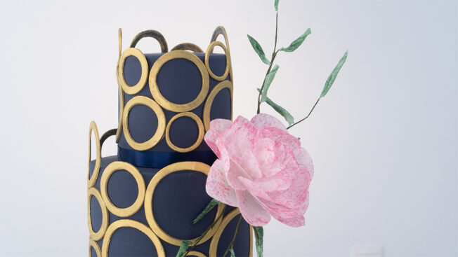 navy and gold wedding cake top tier and flower