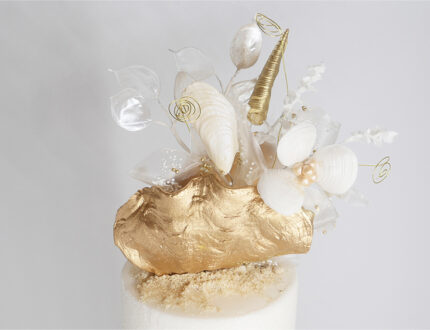 Golden beach wedding cake top tier