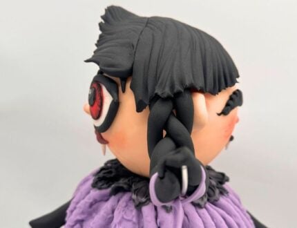 Two-faced vampire Halloween cake side angle